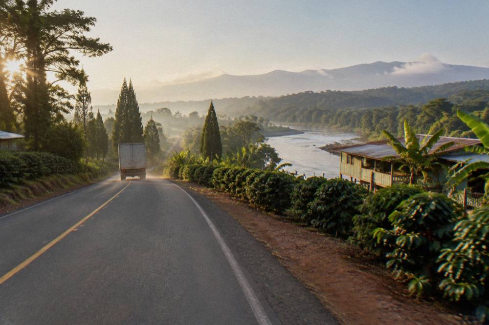 A road winding through dense rainforest hills on the route from San Jose toward Sarapiqui
